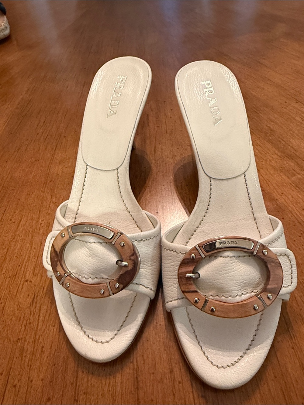 Prada White Leather Slide Mules with Wood-Tone Circular Buckle